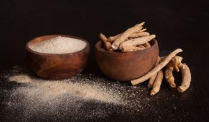 ashwagandha power & roots with wooden bowl 